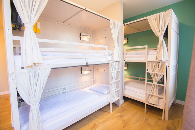 Enjoy the colorful accents and home-like comfort of our dorm rooms, offering a personal and restful space for every traveler at Wombat’s City Hostel London.
